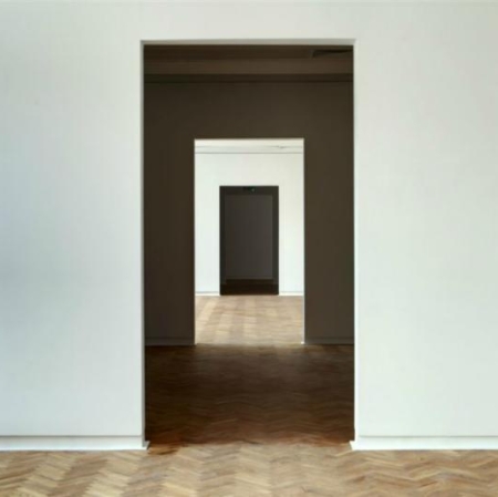 White room with wooden floor