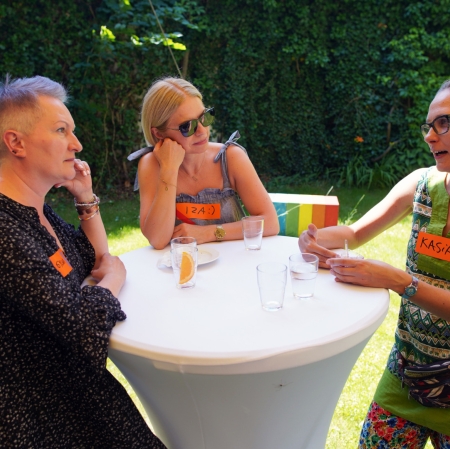 People standing at a white table