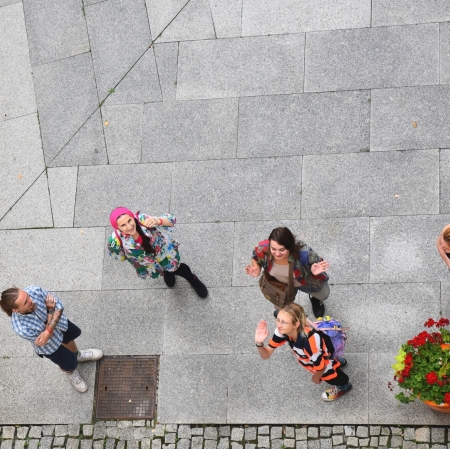 a group of people during a tour seen from above