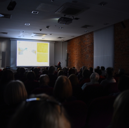 group of people sitting in cinema seats