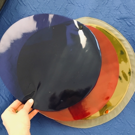 Hand holding a round shape