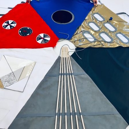 A colorful piece of material spread on the floor