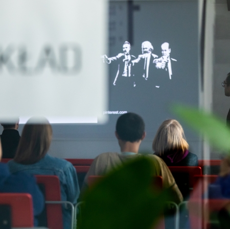 seated people listening to a lecture