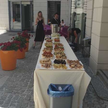 A table set with various dishes and snacks.