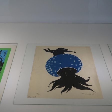 Fragment of the exhibition. Three postcards with abstract patterns placed next to each other.