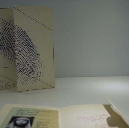 Fragment of the exhibition. A folded card with a large element resembling a fingerprint.