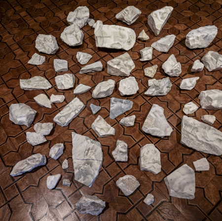 stones spread out on the dark floor