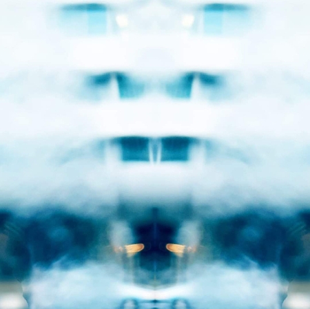 blurred photograph which is a collage, blue and white blurry spots