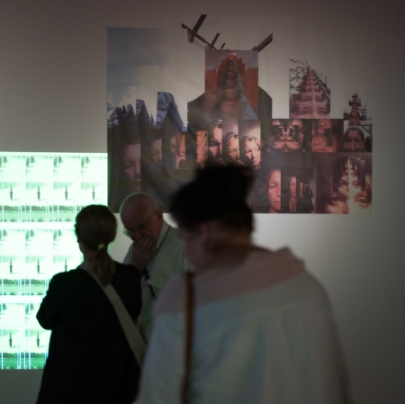 A dozen people in the exhibition space