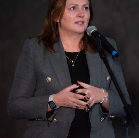 The person standing at the microphone