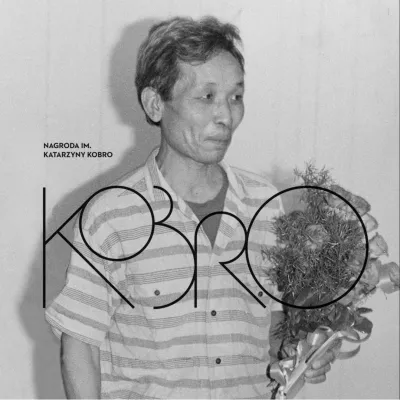 Black and white photo of a person holding flowers